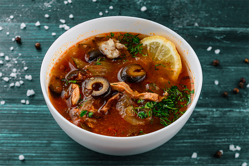 stock photo fish soup solyanka with olives and lemon solyanka spicy and sour soup russian soup with fish 1964123749